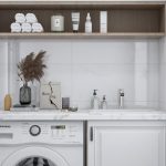 Meuble lave-linge intégré dans une buanderie moderne et lumineuse
